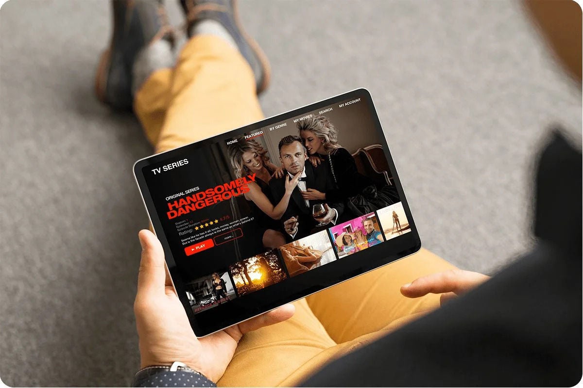 Person Watching Streaming TV Apps on a Tablet
